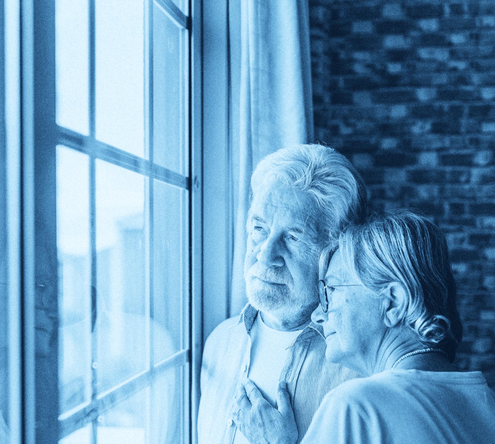 An older couple looking out through a tall window, rendered in navy duotone